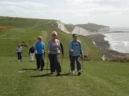 Nordic walkers striding out over the Seven Sisters